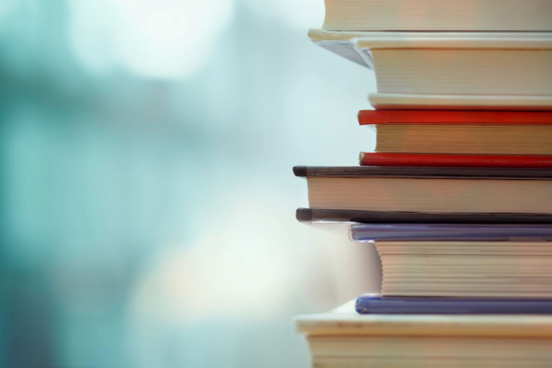 stack of books with blurry background