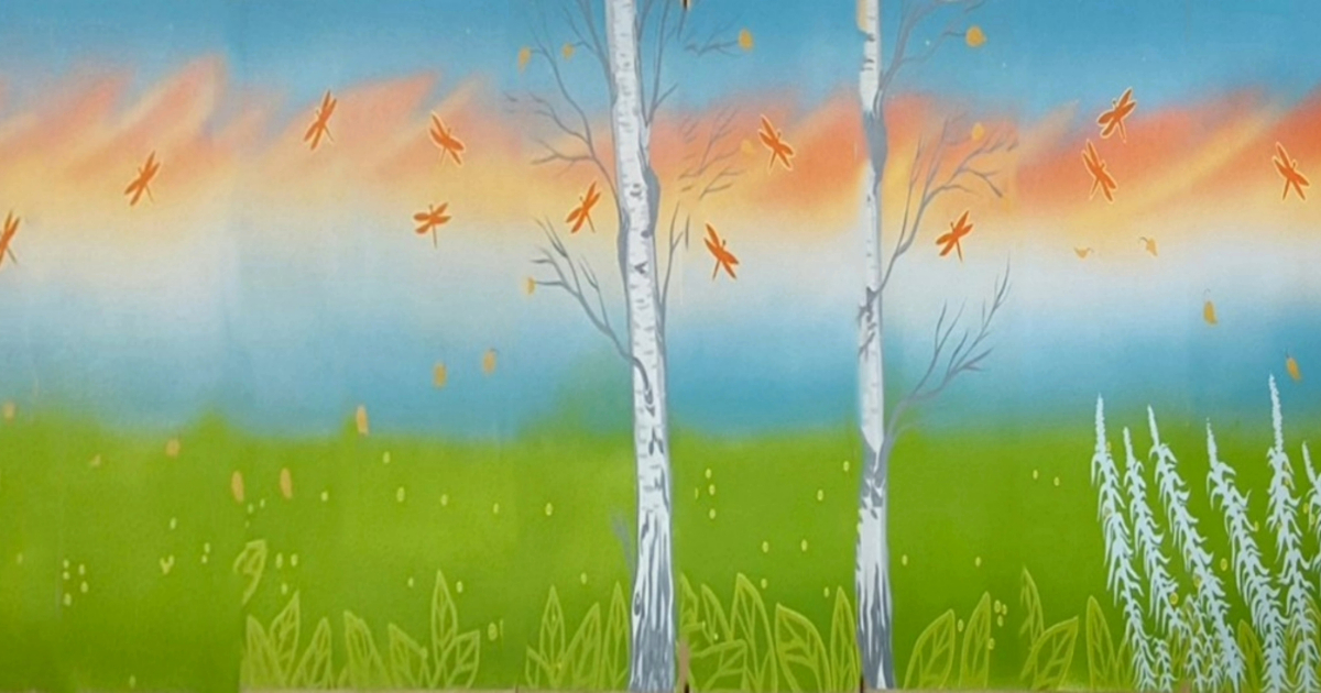 Artwork by Indigenous artist Gayle Sinclair with green grass, blue sky and trees.