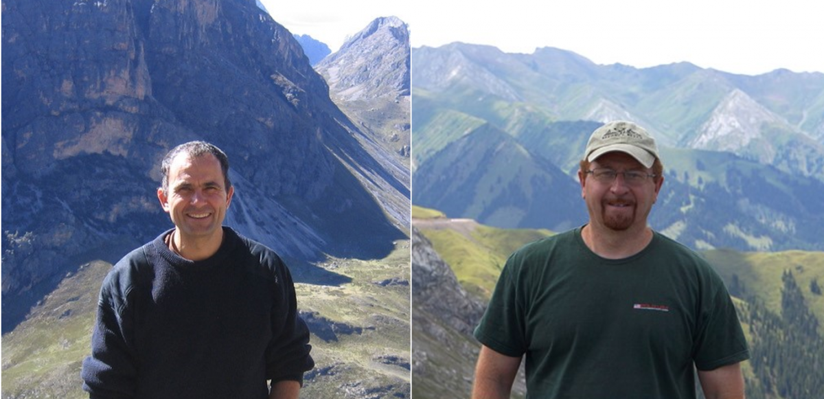 UM Researchers Comacho and Fayek stand at the top of a mountain during feild work.