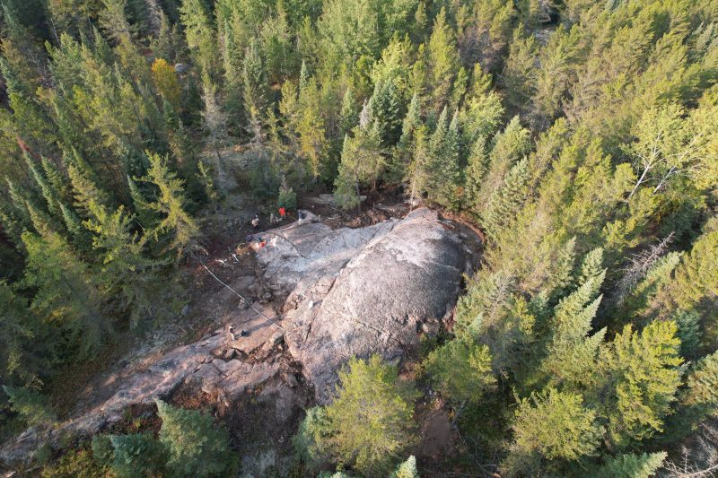 A drone captures mineral exploration amidst forests of the Canadian Shield.