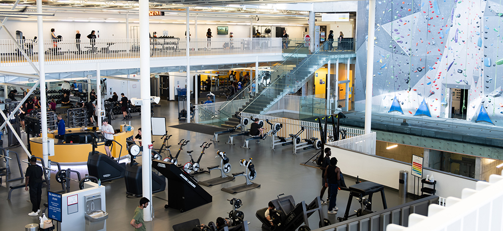 View of Active Living Centre fitness floor and climbing wall from the upper level track.