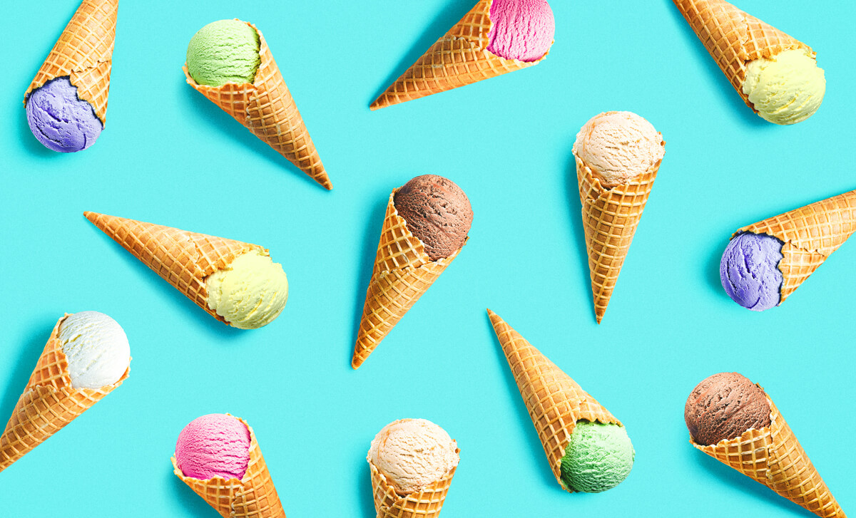 Various ice cream scoops in cones are scattered across a bright teal background
