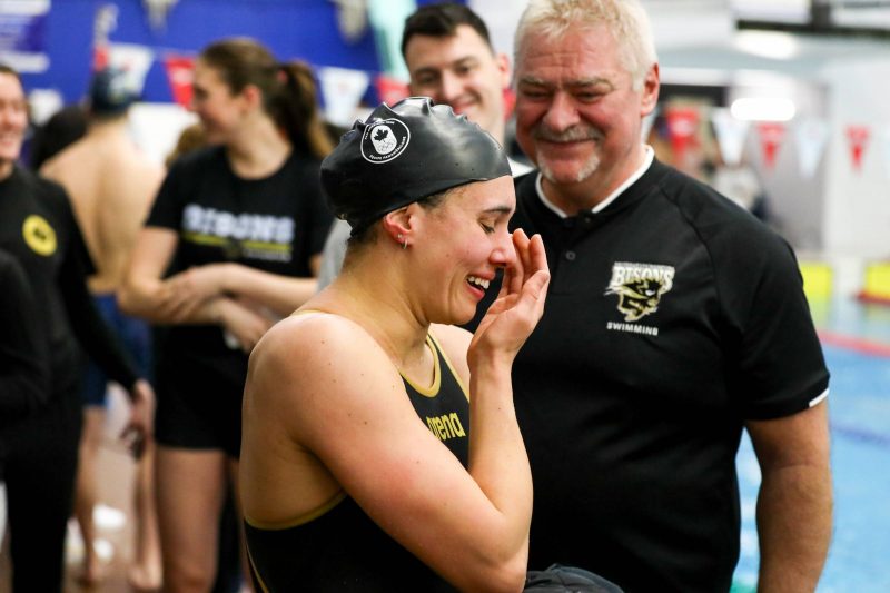 Kelsey Wog and coach Vlastimil Cherney after a race