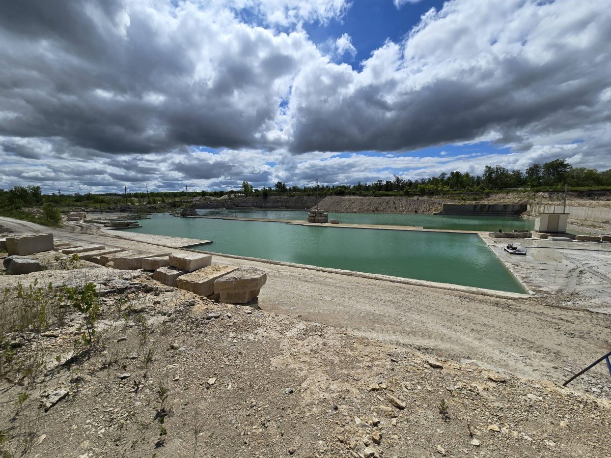 Photo of tyndall stone quarry under a partly cloudy sky.