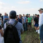 Dr Don Flaten lectures in a field