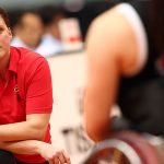 Michèle Sung kneeling during a wheelchair basketball game