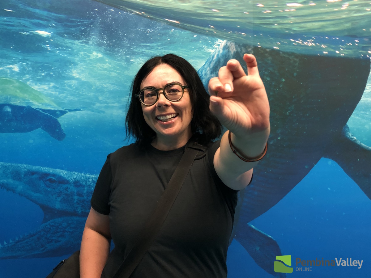 Elise Watchorn from the Canadian Fossil Discovery Centre (CDFD) in Morden holds a recently found shark tooth of a species not known in Manitoba until now