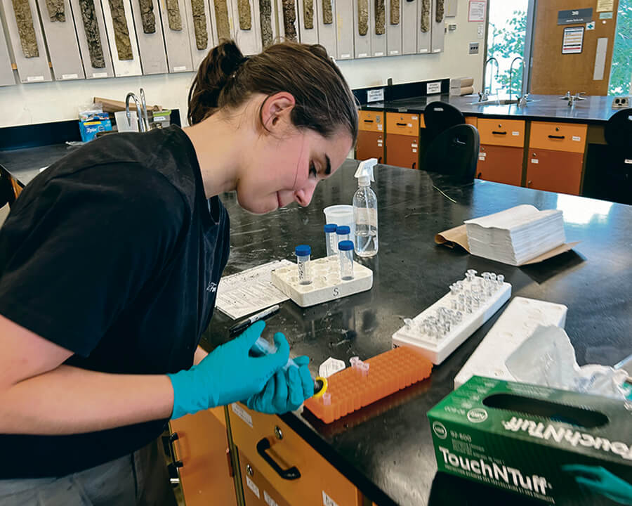 Summer intern works on samples