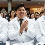 Kodley Bouachanthala, centre, is one of the 140 students in the University of Manitoba college of medicine's class of 2028. He says he can see himself one day retuning to Morden, Man., his home community. (Prabhjot Singh Lotey/CBC)