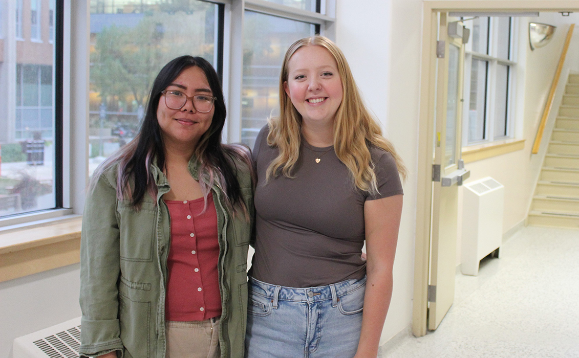 Czynara Gerard Patio and Maya Blair standing in a hallway at the College of Rehabilitation Sciences.