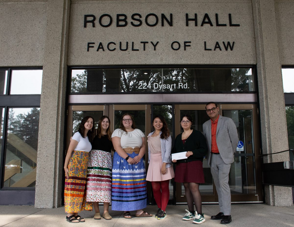 L – R: MILSA members Raven Morrisseau, Chloe Dreillich-Girard, Kaitlyn Clarke, MLA for Fort Richmond Jennifer Chen, MILSA member Kiersten Sanderson, Faculty of Law Director of Legal Learning and Services Marc Kruse