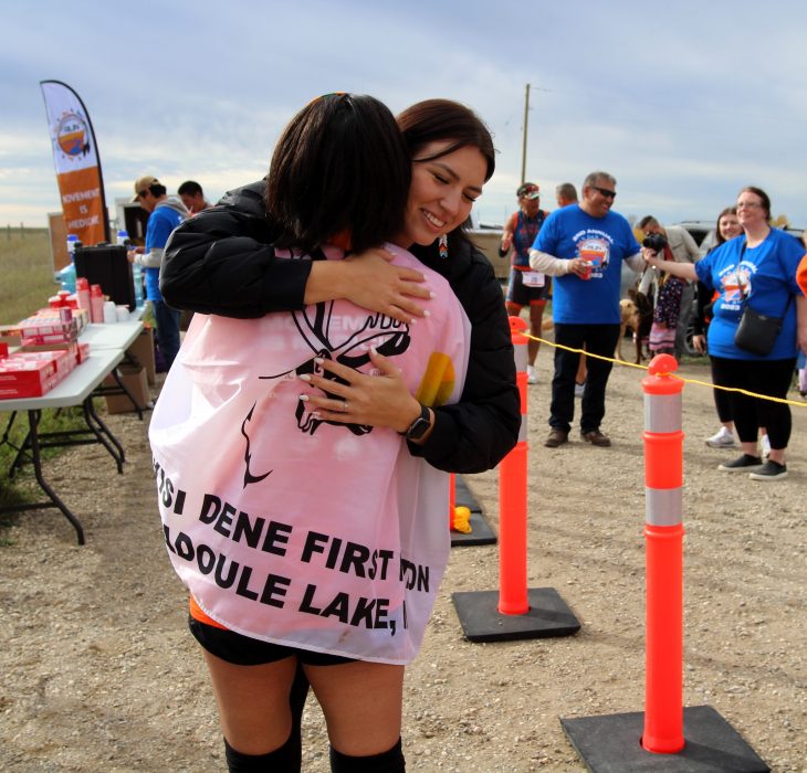 Techelle Bunn hugging a participant at the Reconciliation Run finish line