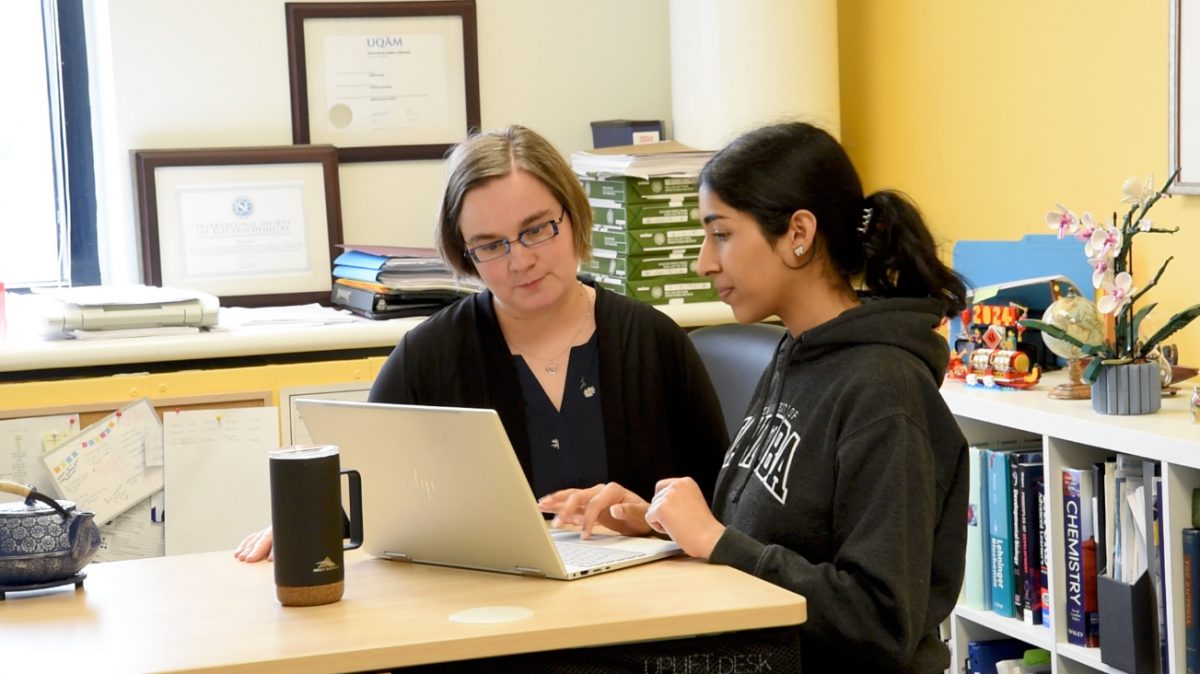 Dr. Sabine Kuss and Shubhneet Thind, student in science talking.