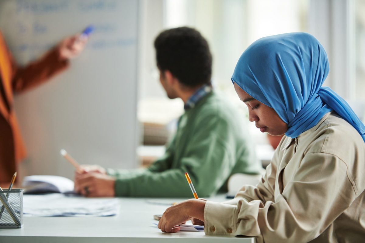 Two students learning in workshop.