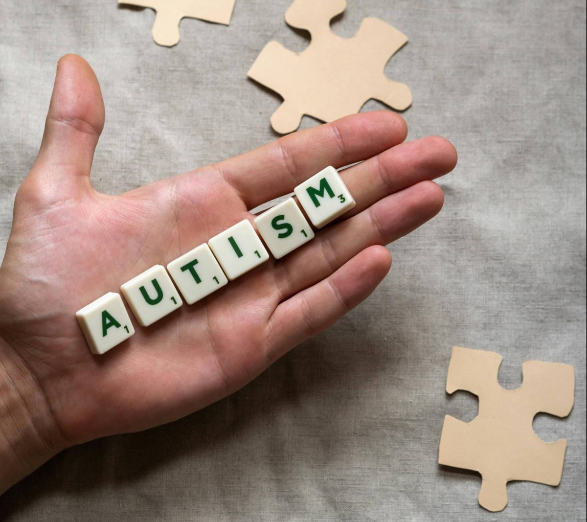 scrabble letters laid out to spell Autism. Photo by Polina Kovaleva