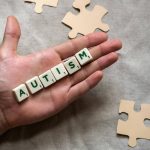 scrabble letters laid out to spell Autism. Photo by Polina Kovaleva