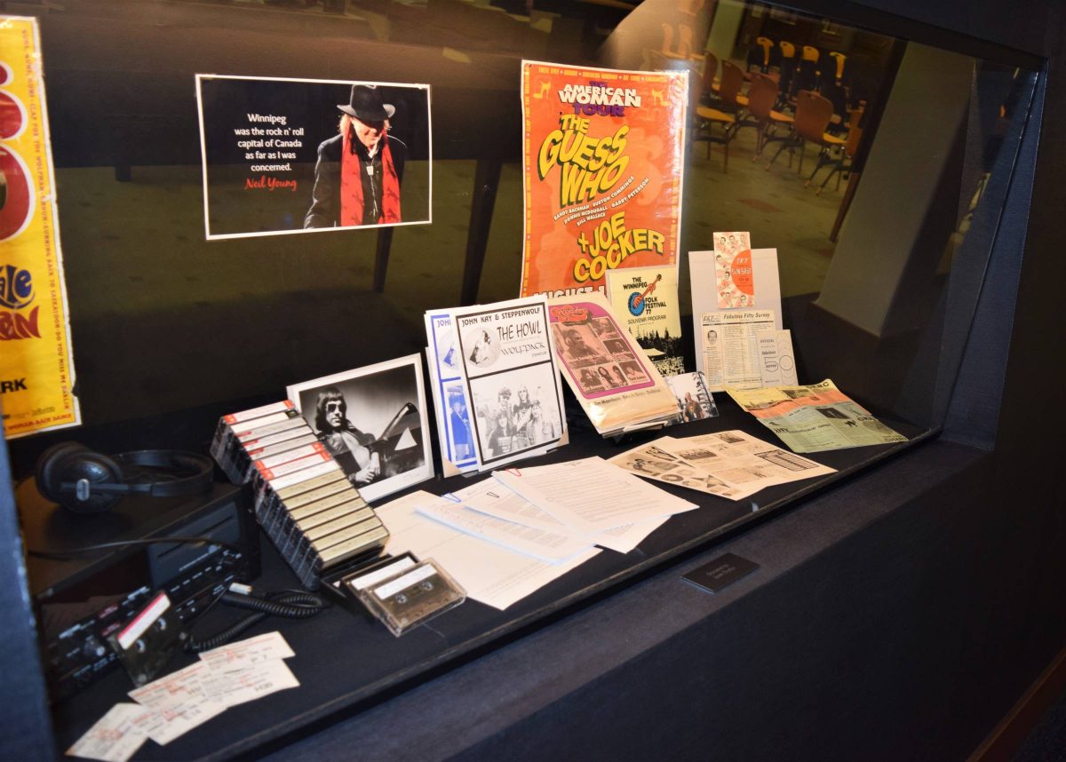 One of the display cases of the Einarson Collection at the UM Archives & Special Collections including posters, manuscripts and more