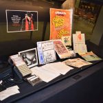 One of the display cases of the Einarson Collection at the UM Archives & Special Collections including posters, manuscripts and more