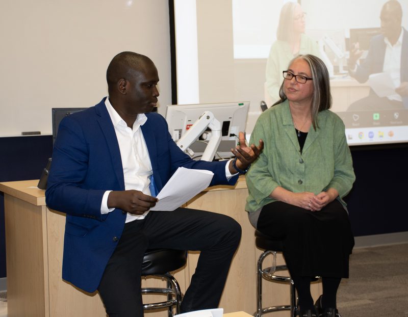 Assistant Professor Akin Ogunranti in conversation with his former PhD thesis advisor, Dr. Sara Seck. Photo by Christine Mazur.