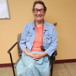 Photo of Karen Courchene sitting in an office in Migizii Agamik