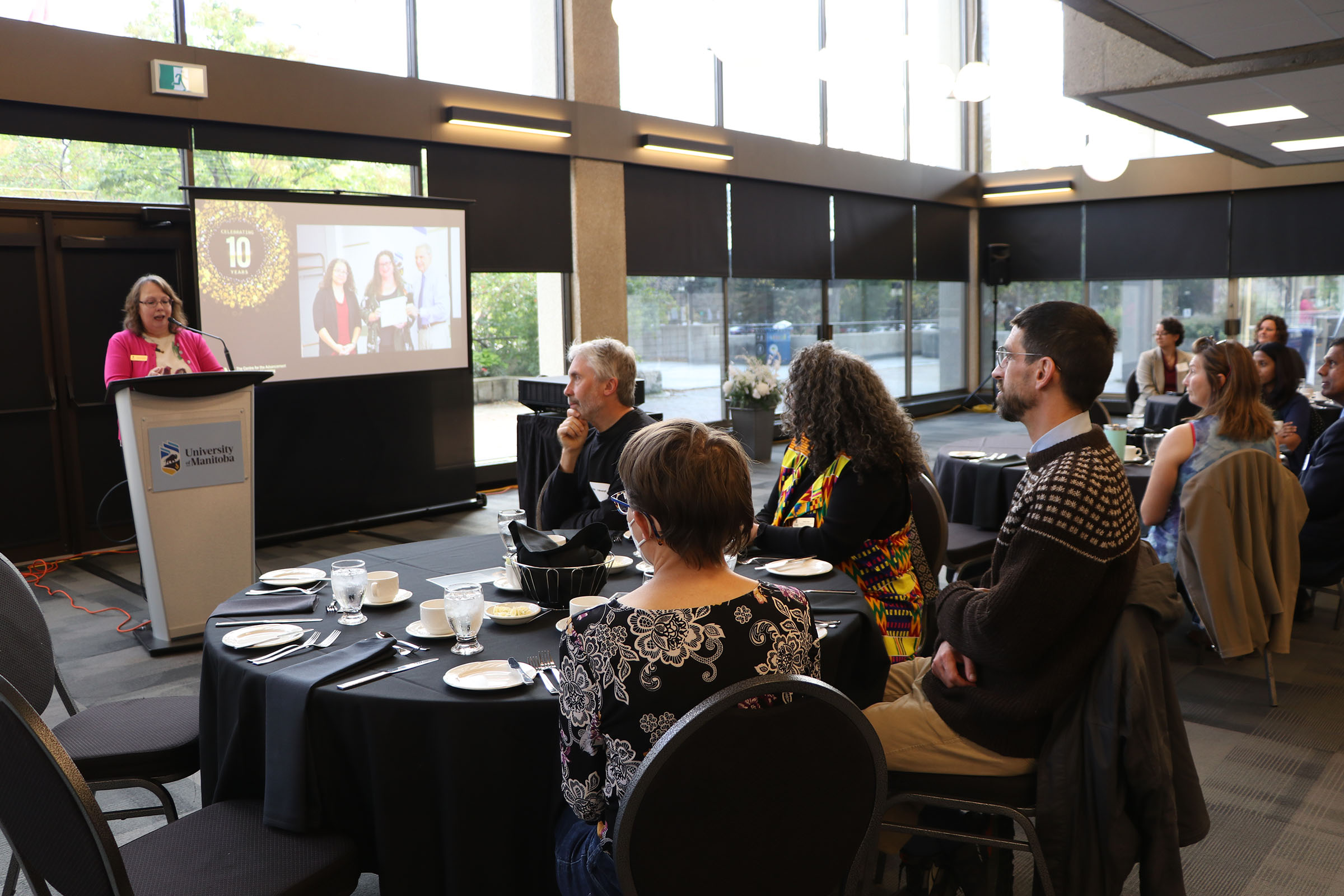 Presenter addresses attendees of the 2024 TLC graduation