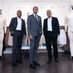 Raj Bahl, Ash Modha and Prashant Modha stand in a retail space for Mondetta