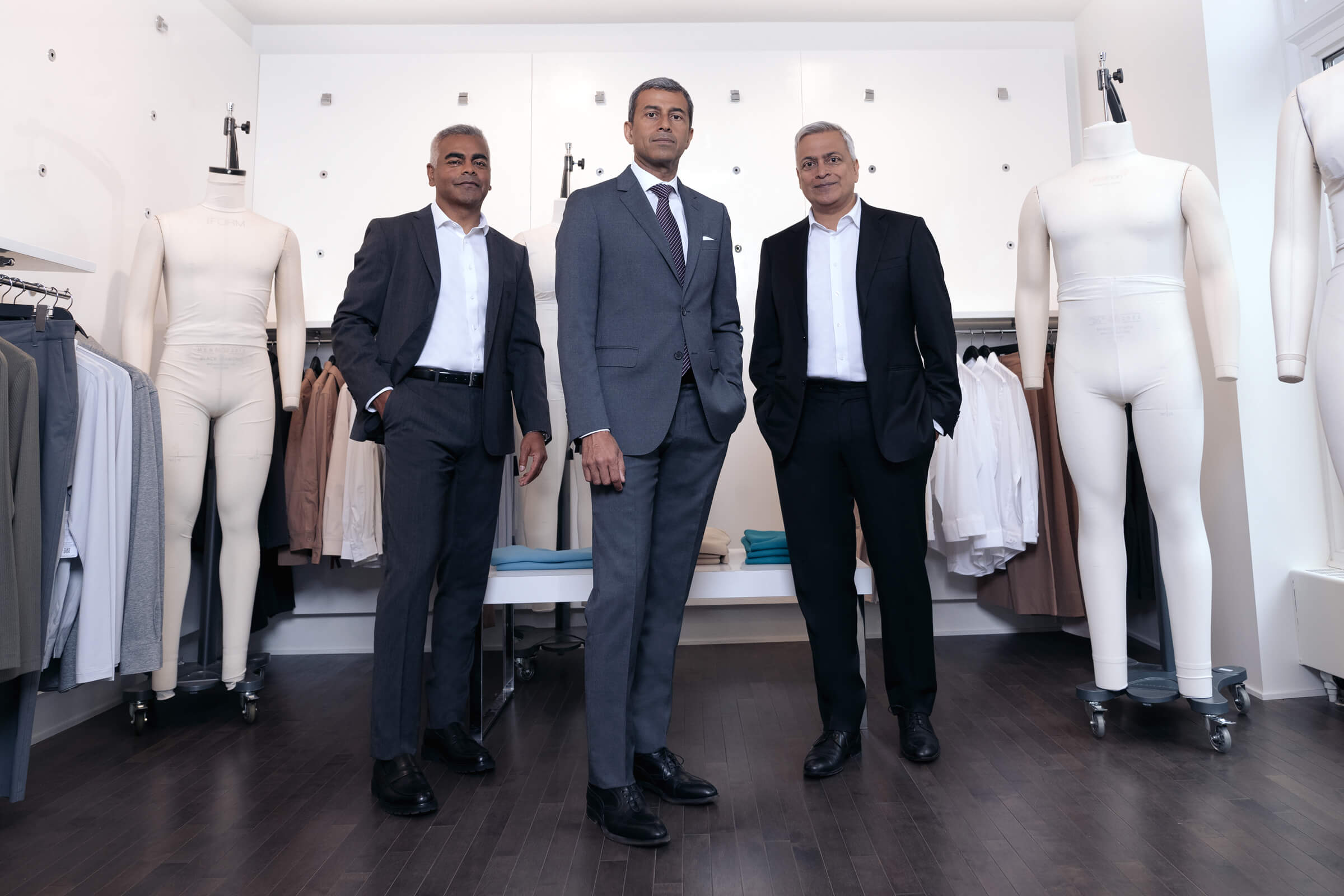 Raj Bahl, Ash Modha and Prashant Modha stand in a retail space for Mondetta