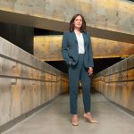 Isha Khan standing in the Canadian Museum for Human Rights