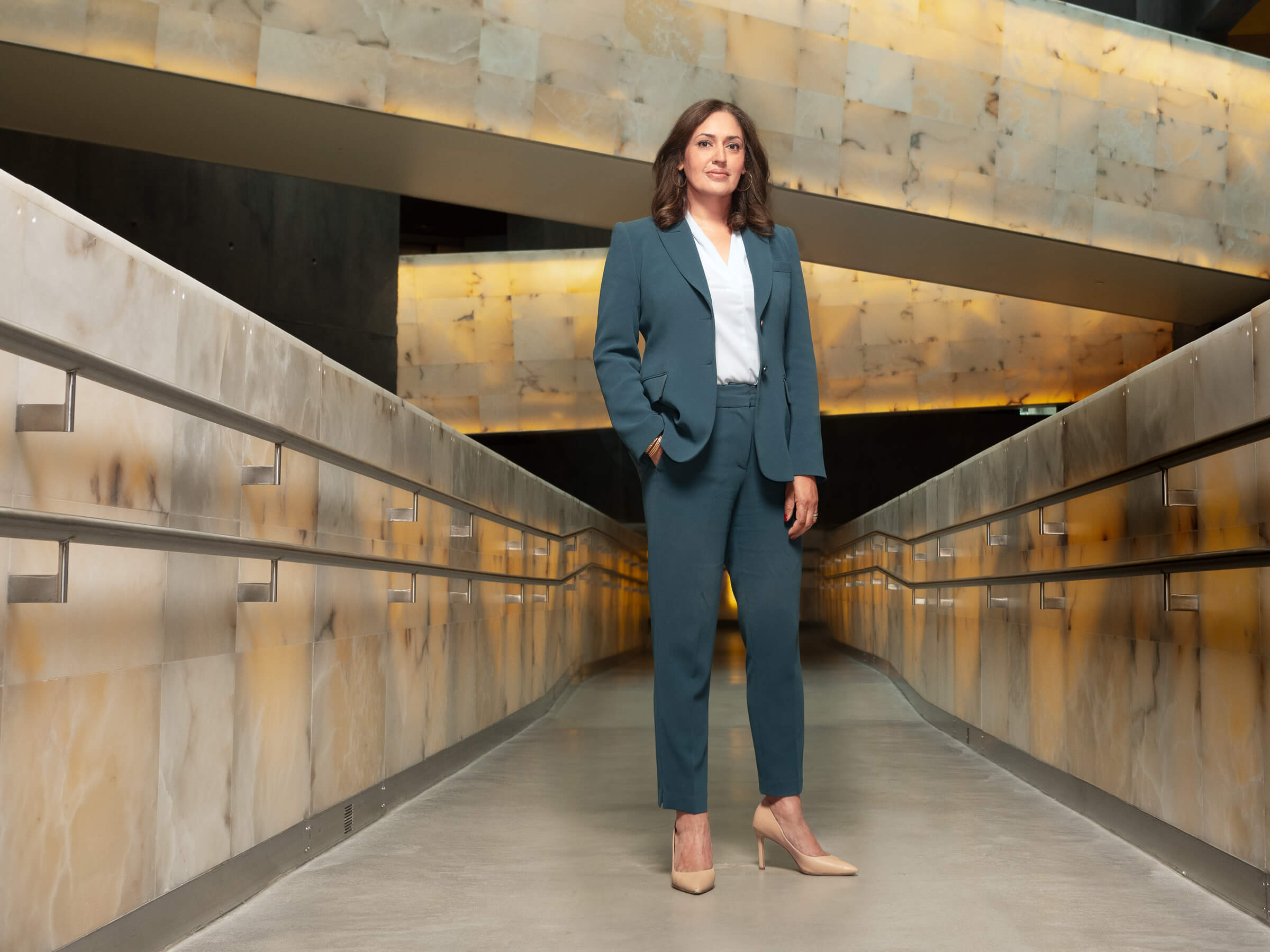 Isha Khan standing in the Canadian Museum for Human Rights