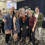 Brita Hall surrounded by guests at the Manitoba Sports Hall of Fame induction ceremony