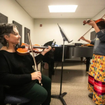 MIKAELA MACKENZIE / FREE PRESS Metis fiddling instructor Patti Kusturok (left) and Indigenous Studies grad student Krysta Alexson at the University of Manitoba.