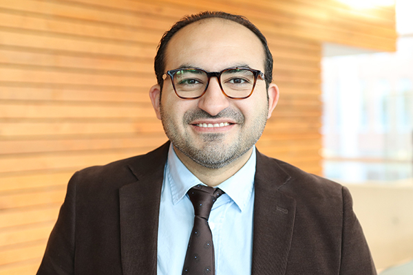 Dr. Sherif Eltonsy, a pharmacoepidemiologist and assistant professor in the College of Pharmacy, smiling in a professional setting.
