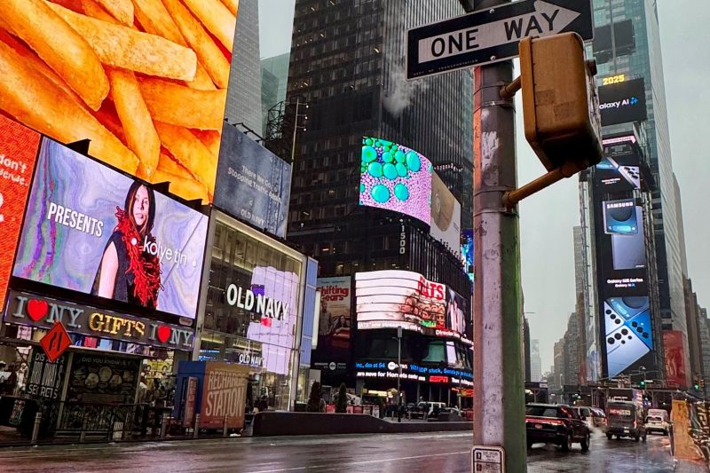 A Times Square billboard features Manitoba designers Koyle TJN amid the busy streets at New York Fashion Week.