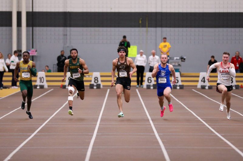 Tyrell Davis sprints on the track at UM