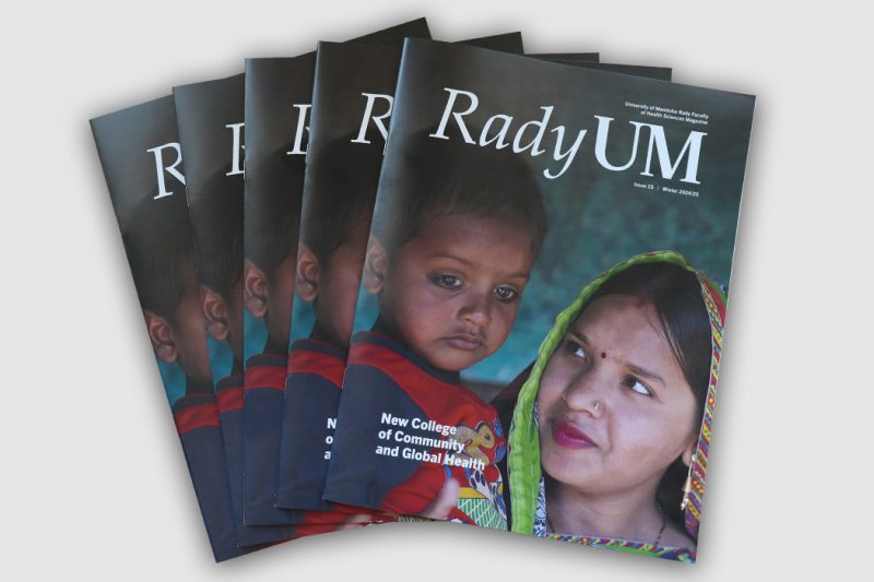 Several copies of the new issue of RadyUM magazine are fanned out on a table.