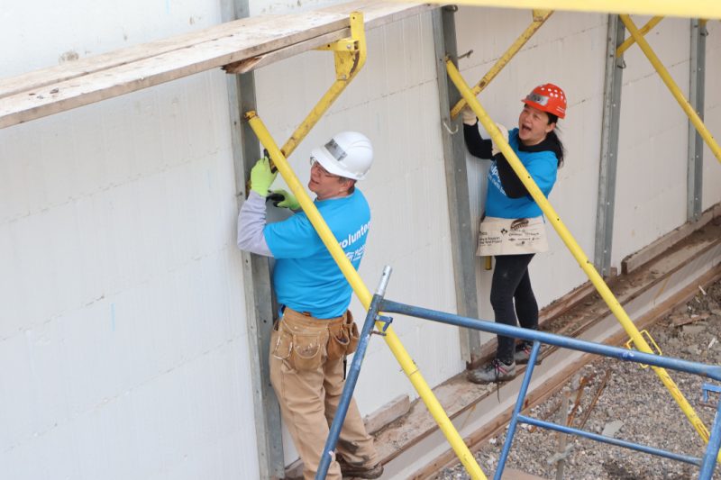 Two people on a construction site. 