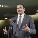 Manitoba Premier Wab Kinew speaks with media before at a First Ministers Meeting at the National War Museum on Friday, March 21, 2025, in Ottawa. THE CANADIAN PRESS/Adrian Wyld