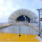 The Churchill Marine Observatory Ocean's Sea-Ice Mesocosm, the covered CMO building sits behind the pool outside waiting for sea-ice experiments.