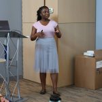 A student is immersed in their presentation during the Earth Sciences Graduate Symposium.