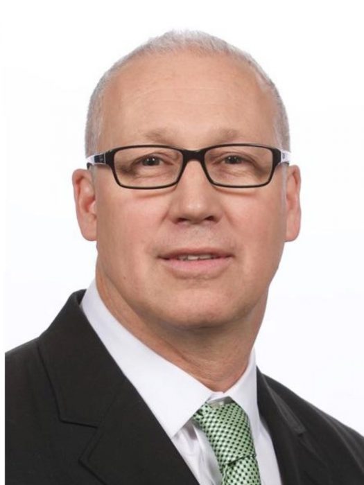 Dr. Jason Peeler's headshot against a white background.