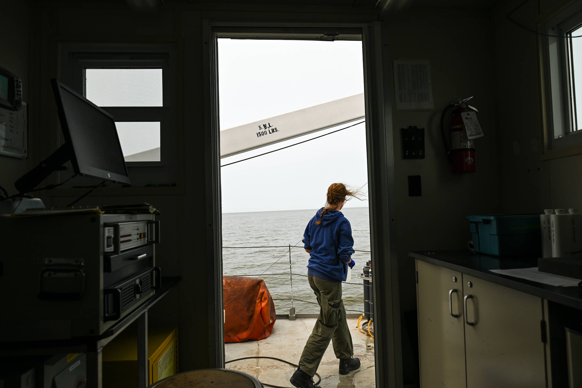 UM student Grace Oliver is framed in the doorway aboard the Namao research vessel
