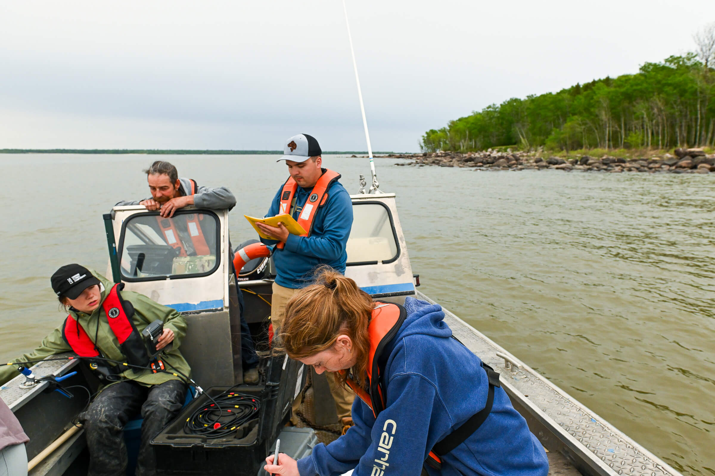 Clockwise from left: UM alum Tylo Chadney, deckhand and commercial fisherman Kevin Palson, Namao science coordinator Riley Versluis, and UM student Grace Oliver
