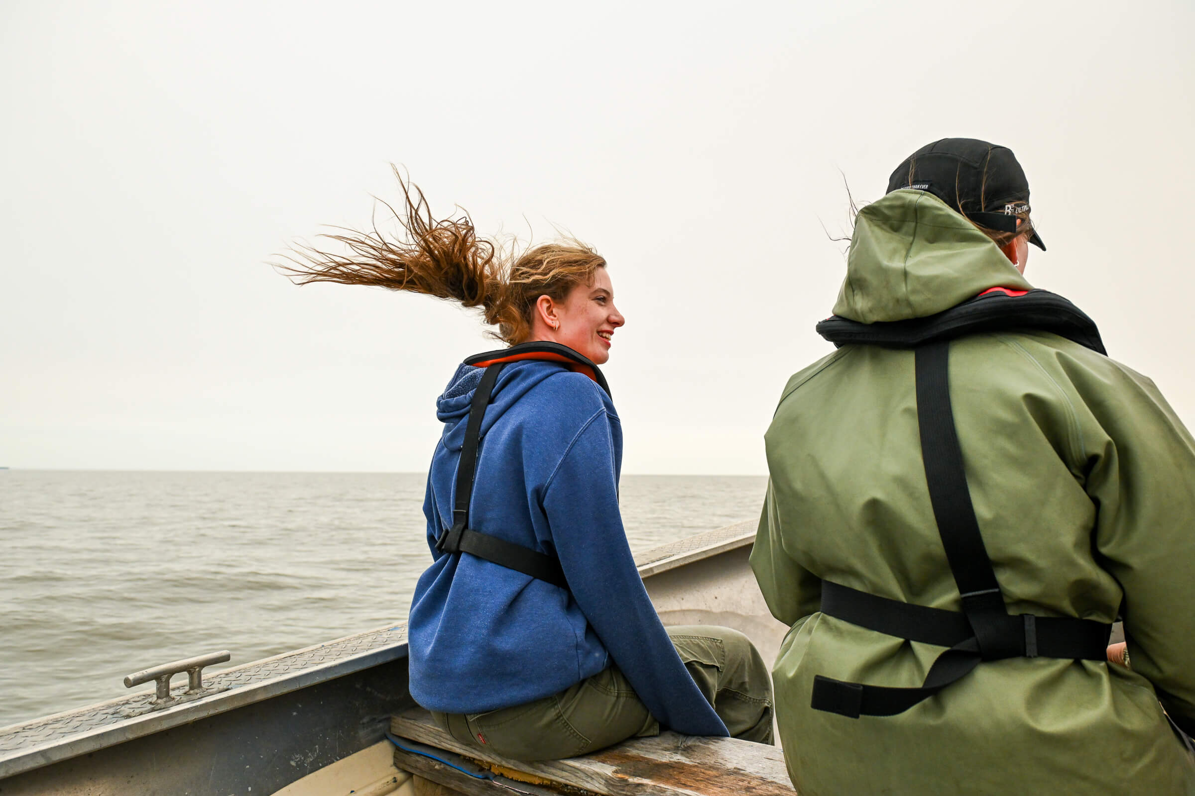 UM undergrad student Grace Oliver races back to the ship after collecting water samples near Lake Winnipeg’s eastern shore.