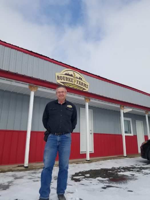 David Rourke posing for a photo on "Rourke Farms" property.