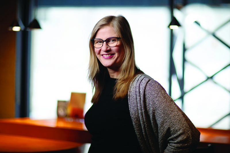 Stefanie Wiens inside a theatre lobby.