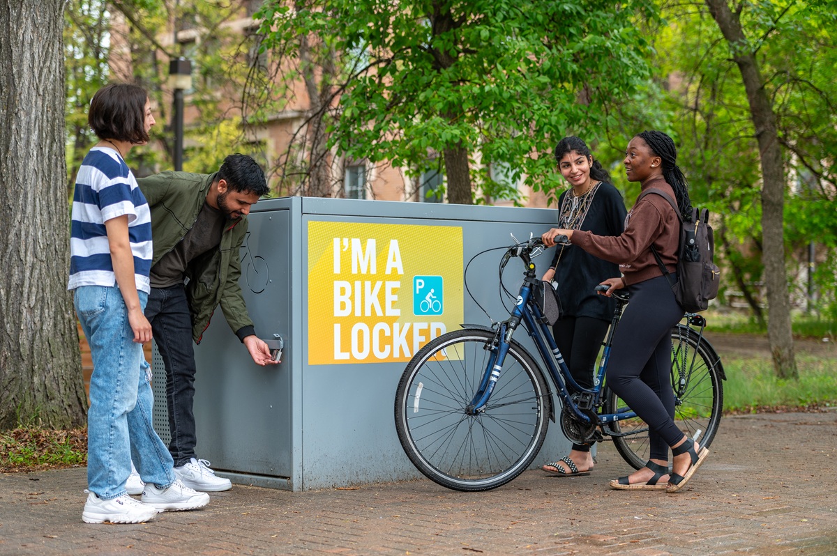Students gather around a bike locker