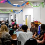 Daniel Heschuk and Shad students at a table talking.