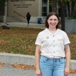 Ashley Bell stands outside of the College of Nursing's Helen Glass Centre for Nursing at Fort Garry campus.