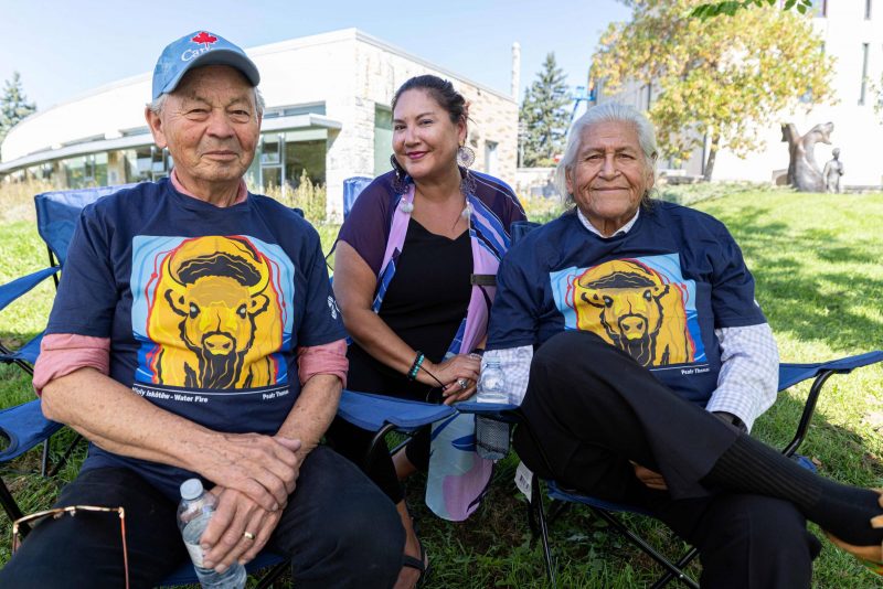 Two male Elders and a female staff member.