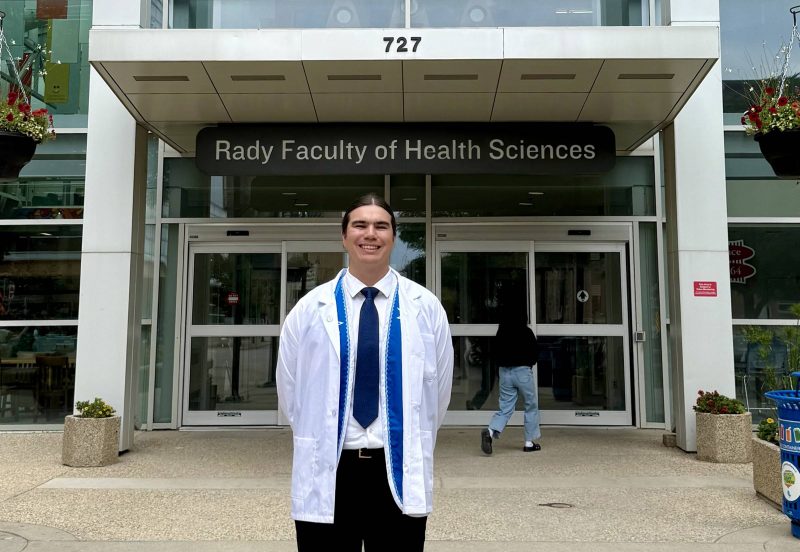 Student in white coat by Rady